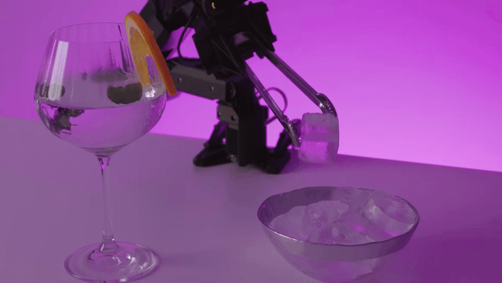 ElRobot arm teleoperated to pick an ice cube and drop it into a glass