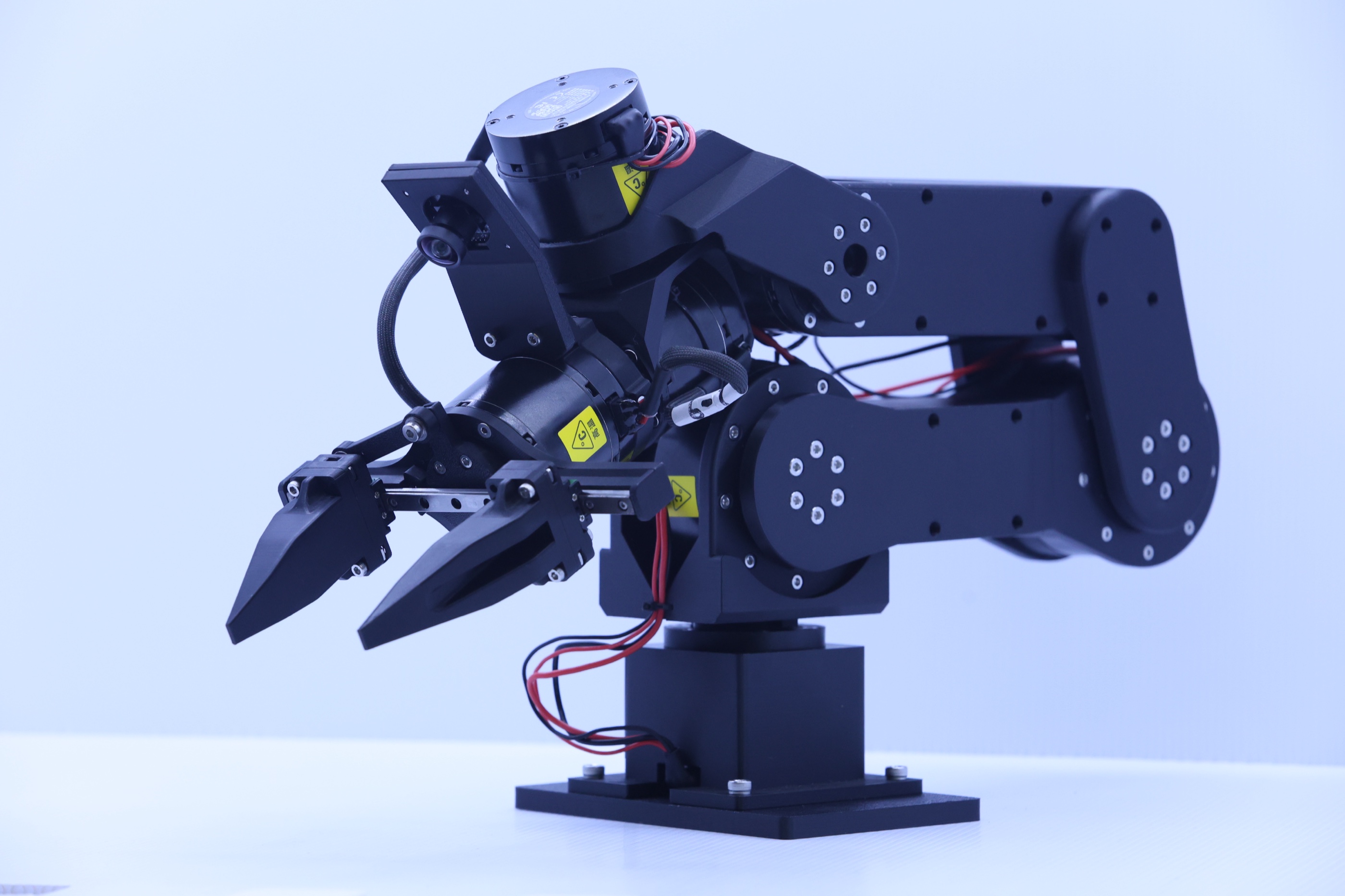 Maker Arm shown fully assembled with its gripper, joints, and base visible