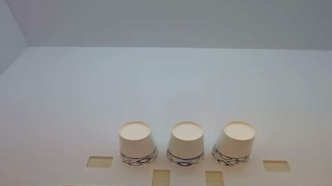 Three cups arranged for a cup-stacking robot skill