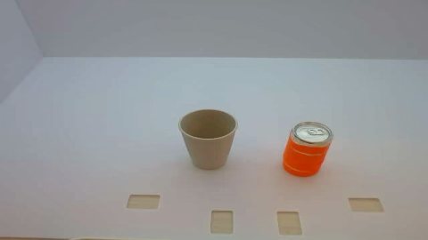Cup and orange drink arranged for a pouring skill